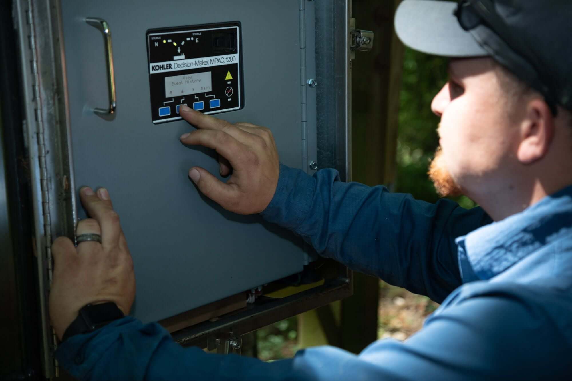 Technician working with a Kohler MPAC panel