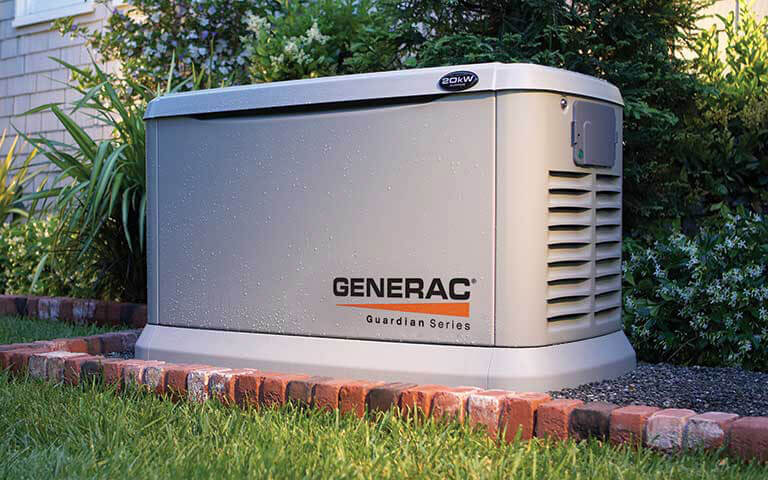 Generac generator seated outside a home in the landscaping